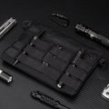 Black Oxford cloth portable outdoor organiser kit measuring 18 by 3.5 centimetres
