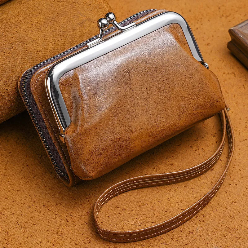 Ladies' leather-look coin purse with a 4-inch metal clip and zip closure in five colour options.