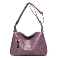Single-shoulder women's bag in PU with soft build, urban minimalist style, shown in black, yellow, gray, red, green, blue, or purple