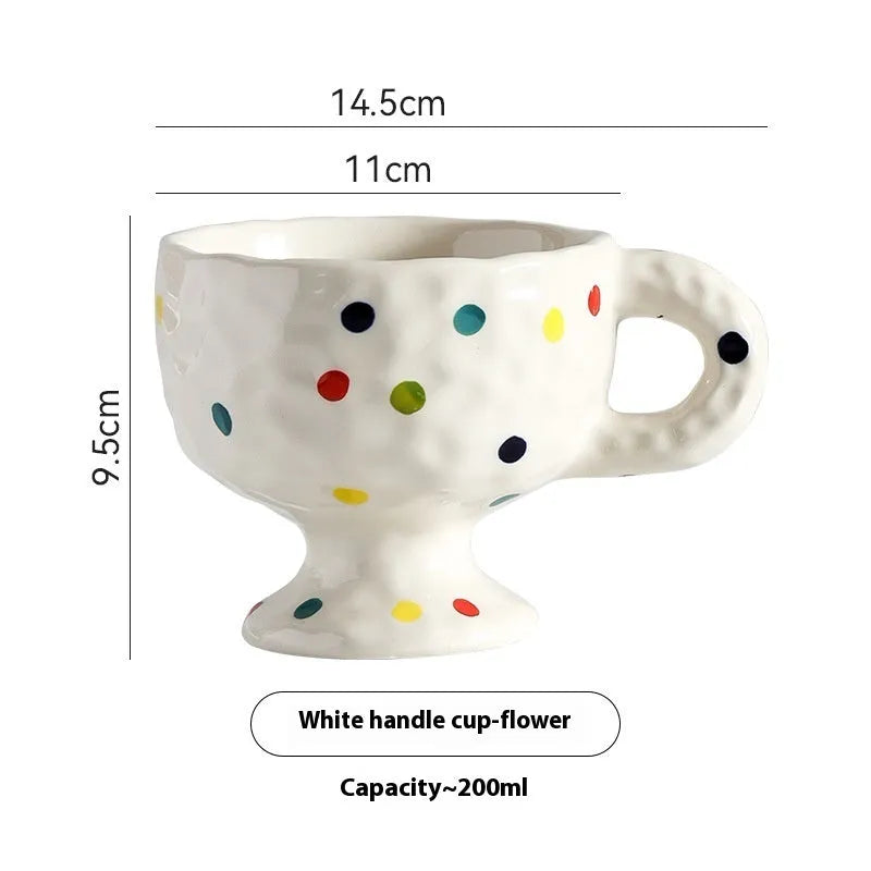 Hand-pinched irregular ceramic mug showing solid colour and unique shape