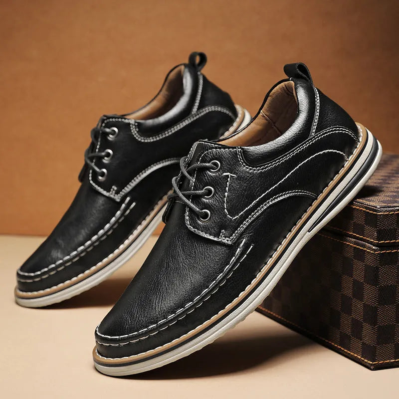 Men's black genuine leather casual lace-up shoes with round toe and rubber sole on a white background.