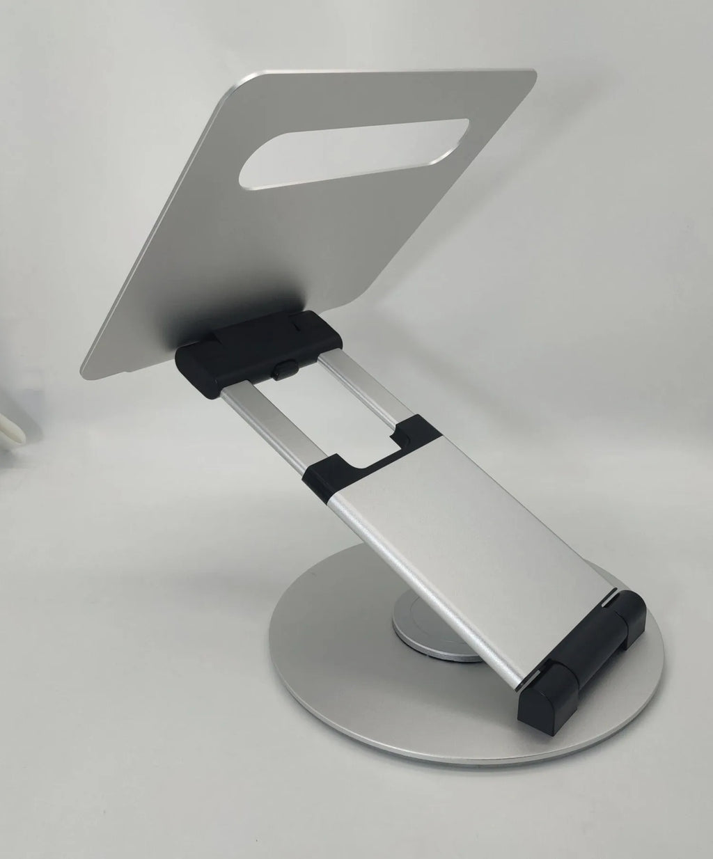 Aluminium alloy laptop bracket on desk with 360-degree rotating base and lifting mechanism
