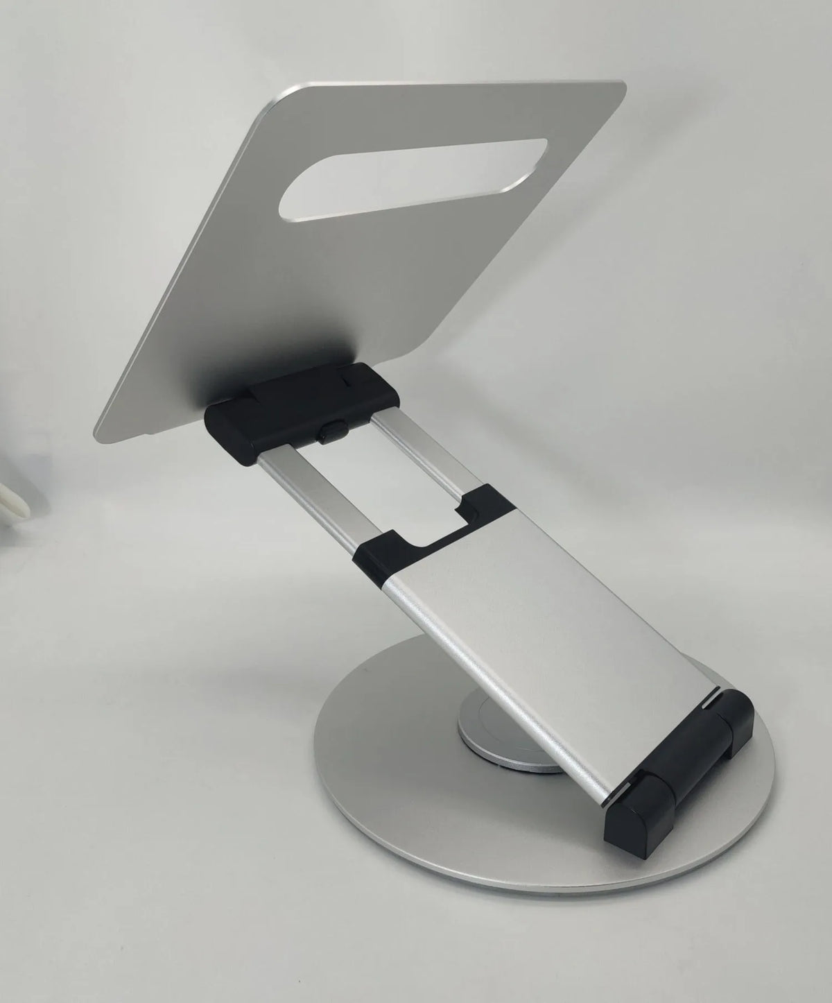 Aluminium alloy laptop bracket on desk with 360-degree rotating base and lifting mechanism