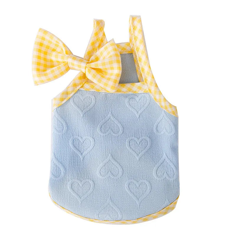 Small dog wearing heart bow suspenders vest in elastic polyester pet clothing