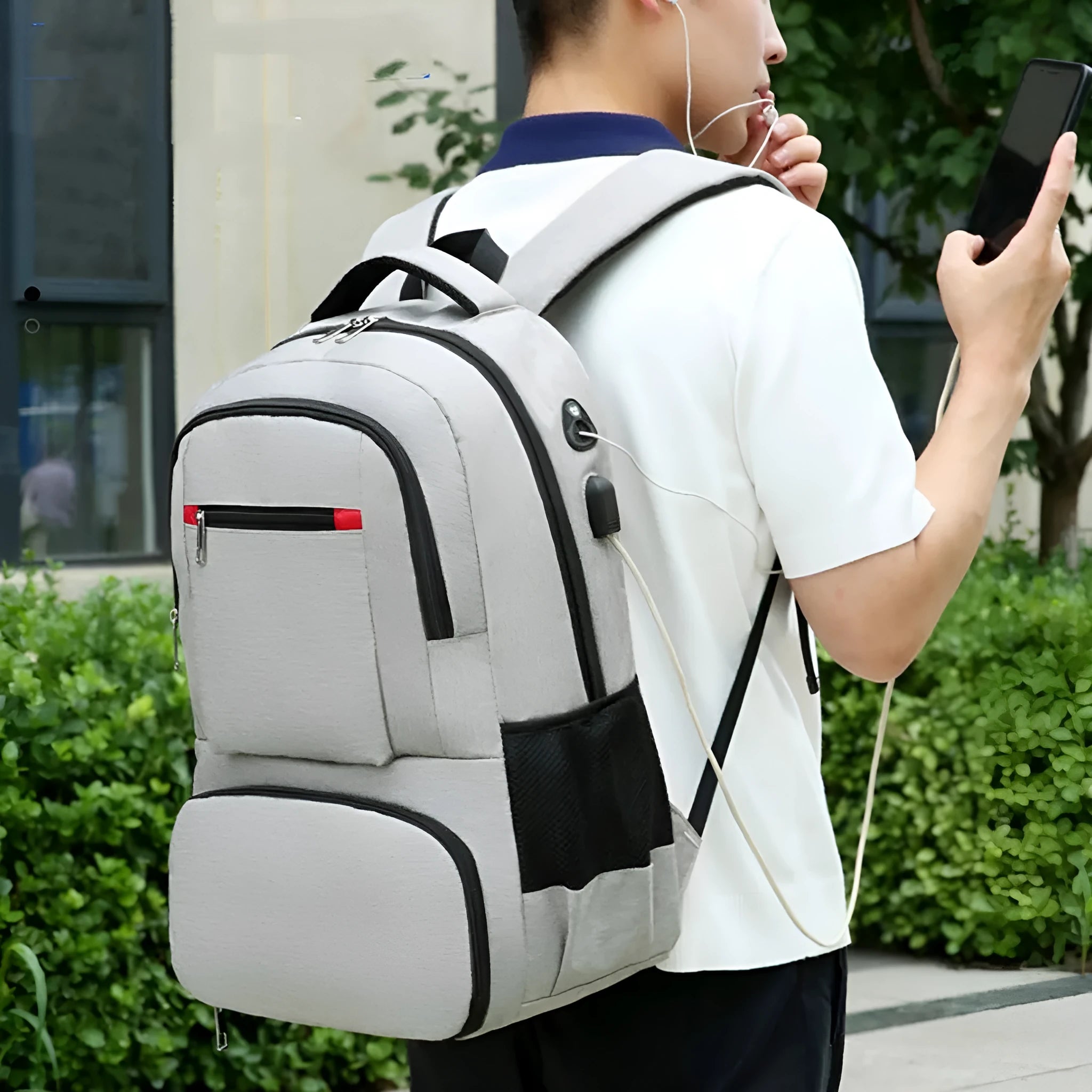 Oxford cloth insulated backpack with curved shoulder straps shown in light grey colour with dry-wet separation compartments visible