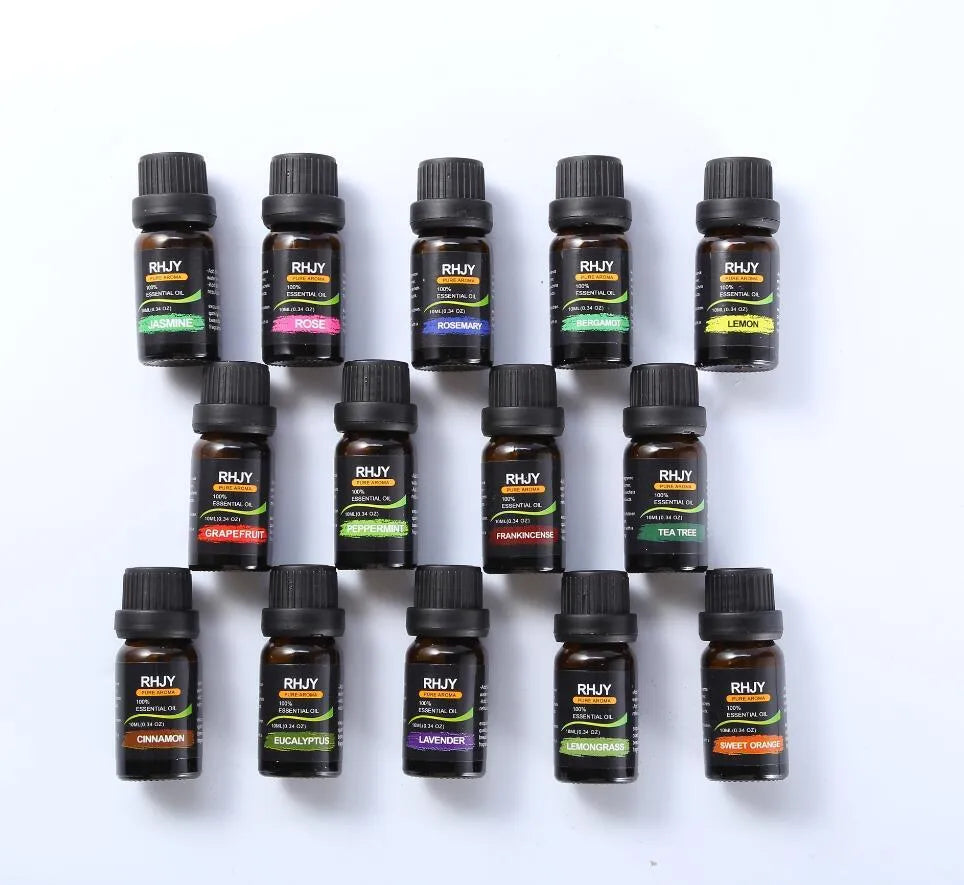 Essential oil set of 14 fragrances in 10ml bottles including rose, lavender, and lemon on a surface