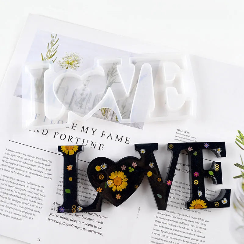 Flexible silicone epoxy mould showing raised letters for words love, home, family, live, hello, blessed.