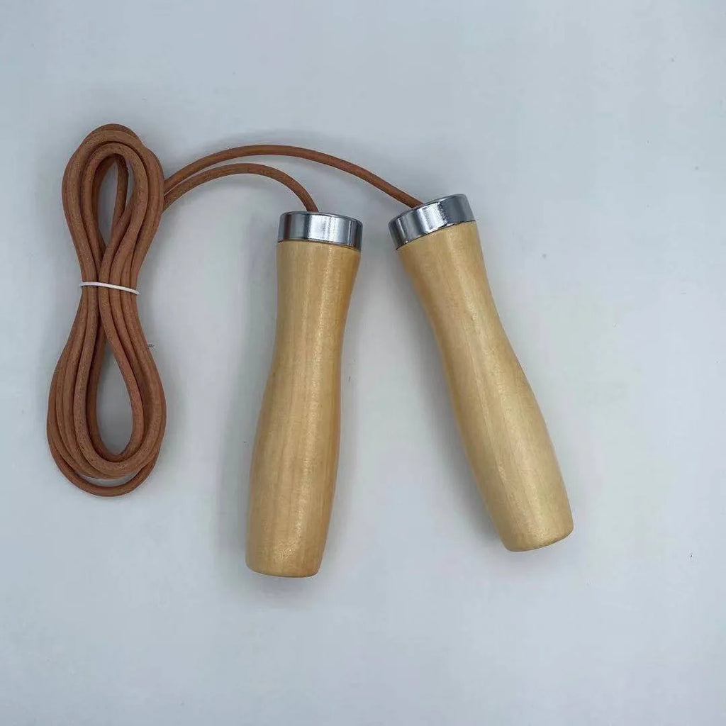 Real cowhide leather jump rope with solid wood handles and denim grip on grey background