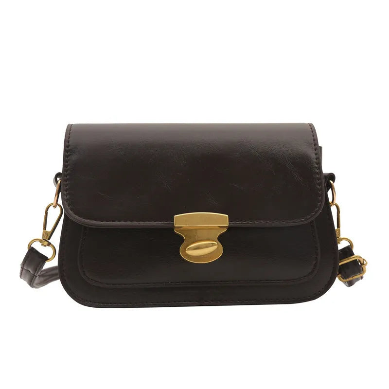 Small horizontal square handbag in soft PU leather, shown in black, brown, dark brown, and light brown.