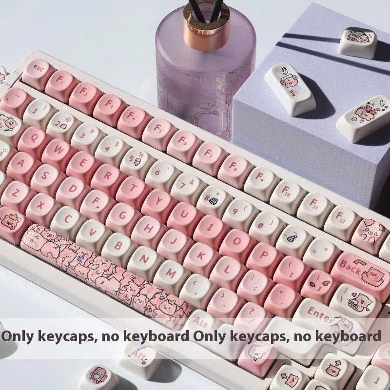 Pink PBT key cap with fragrant pig design on all five sides, shown with keycap puller tool
