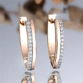 Women's V-shaped electroplated copper ear clips in Champagne Gold and White Diamond geometric design