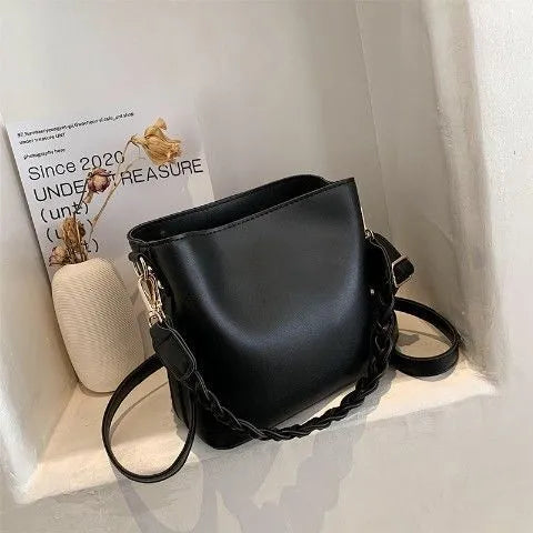 Retro woven PU leather bucket bag in khaki colour with crossbody strap.
