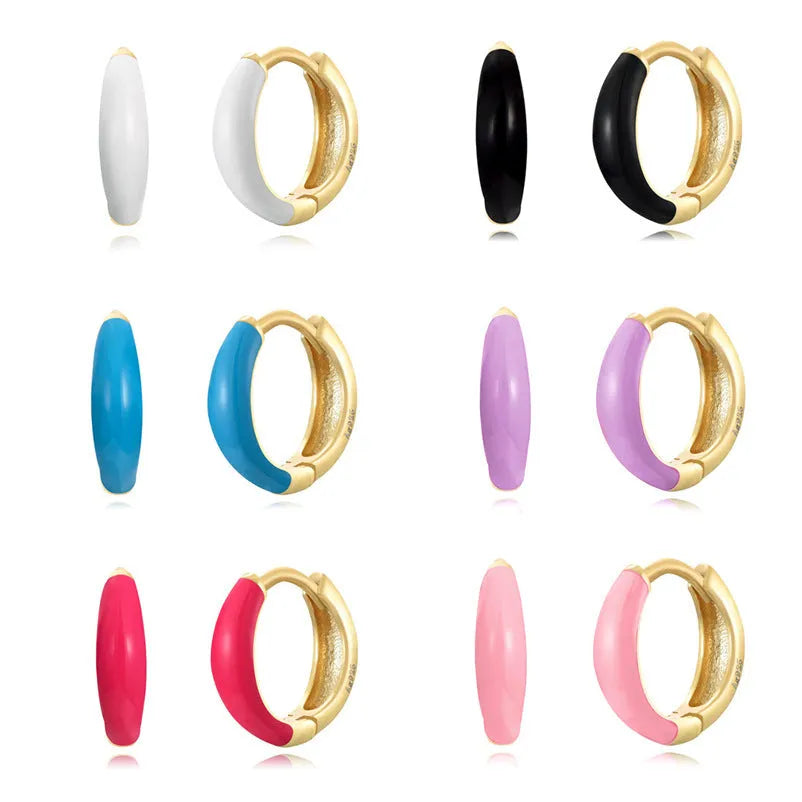 Oval-shaped curved drop earrings with colourful epoxy resin drip finish and silver metal pin.