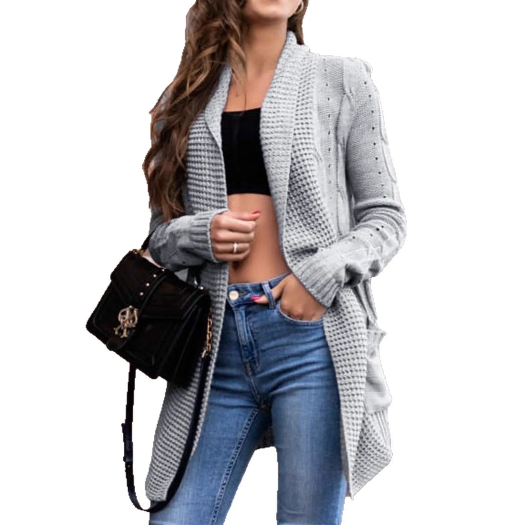 A grey women's loose-fit viscose cardigan coat with pockets on a hanger.