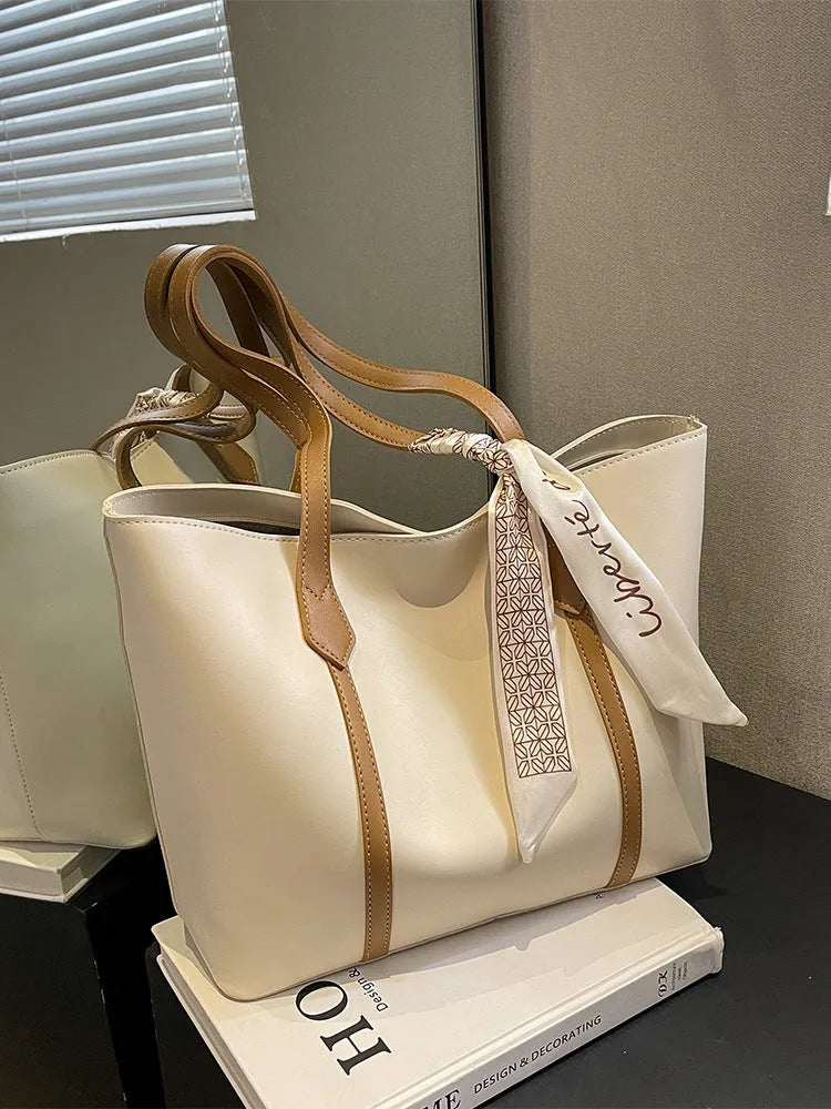 Large capacity bucket-style tote bag in multiple colour options with sandwich pocket exterior