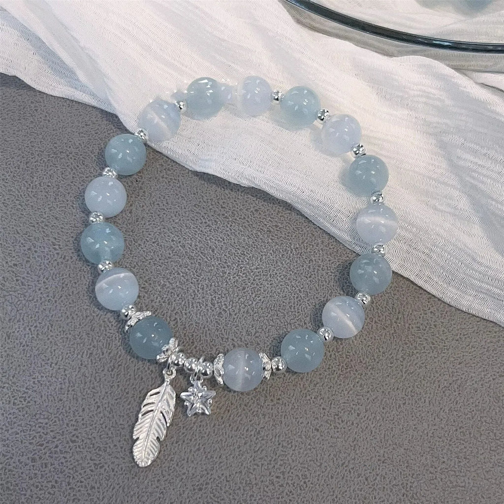 Small white crystal bracelet with eight star design in blue moonlight colour