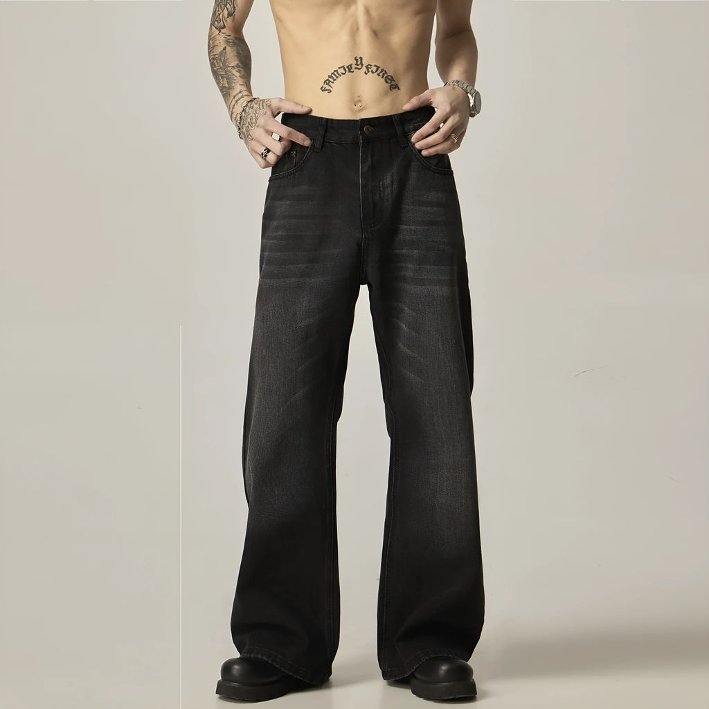 Black loose straight retro jeans with zipper fly closure on plain background