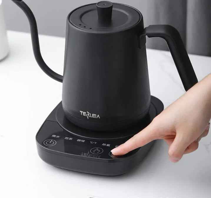Black stainless steel slender mouth touch control electric kettle with inner scale marking on a desk