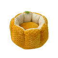 Orange pumpkin-shaped pet nest bed for cat or small dog with cotton filling.