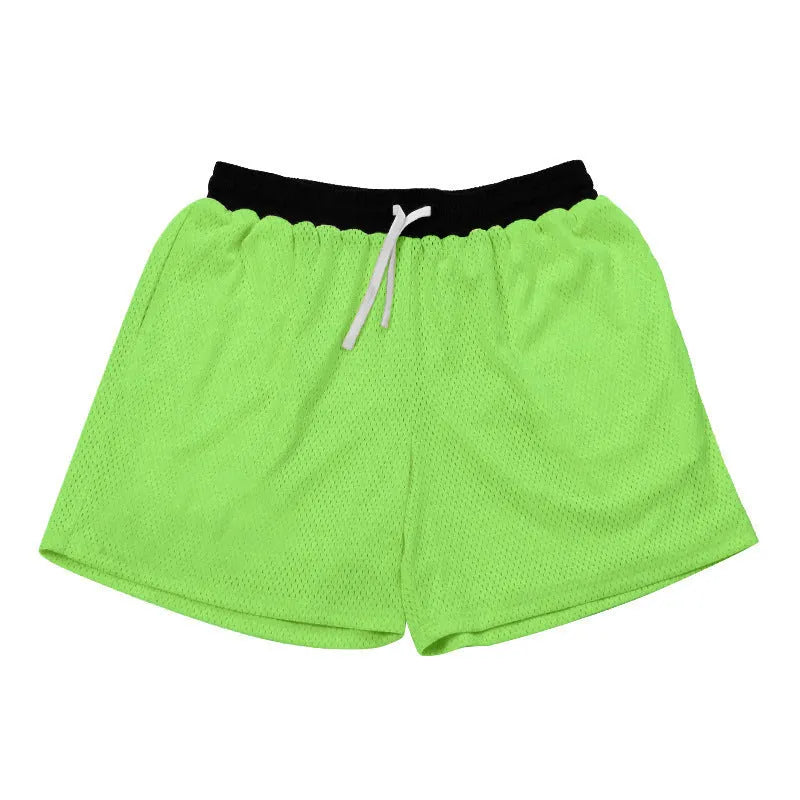 Man wearing black mesh quick-drying shorts for running or fitness training.