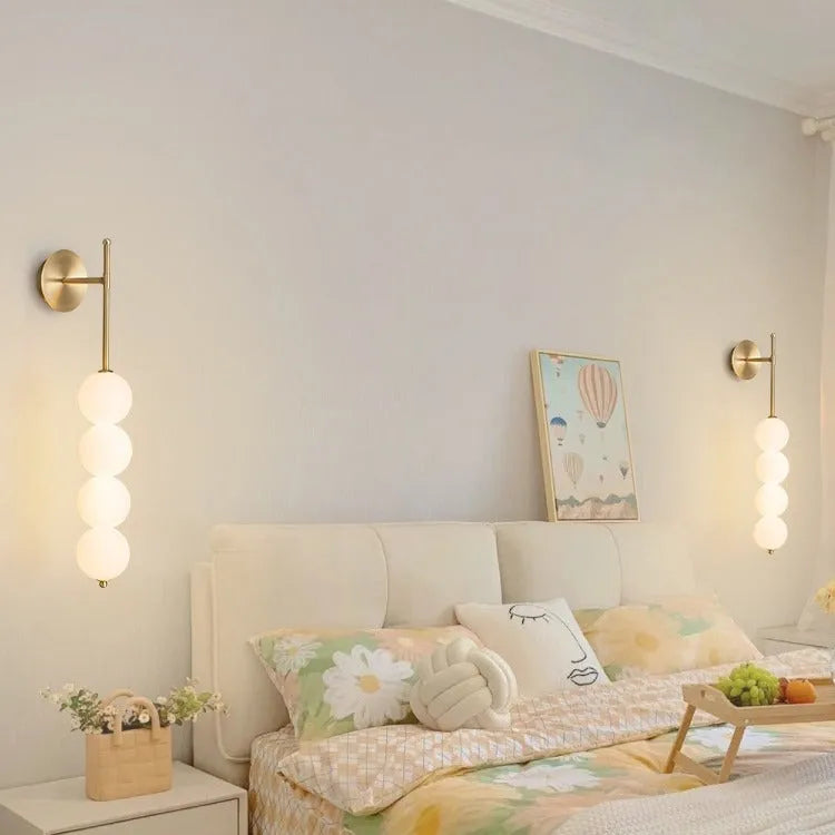 Nordic wall lamp in gold finish with tricolour light, rotomoulded construction for bedside atmosphere