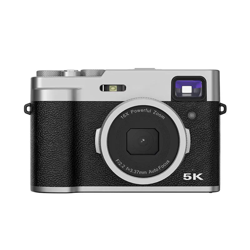 Black or brown 5K HD digital camera with dual lenses and an optical viewfinder on a table.