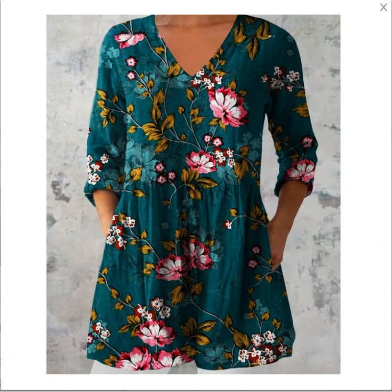 Women's floral wave print dress with wide waist and three-quarter length sleeves on a hanger.