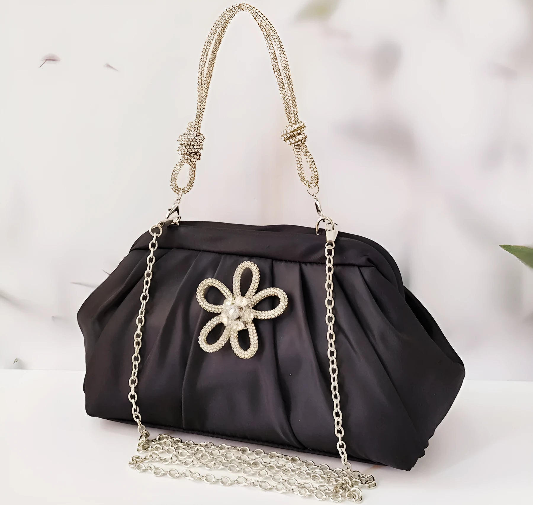Women's black polyester messenger bag with chain detail, diamond patterns, and document organiser compartment