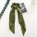 Long cloth ribbon hair tie in spring dark green colour with large intestine ring shape for ponytail or bandeau styling
