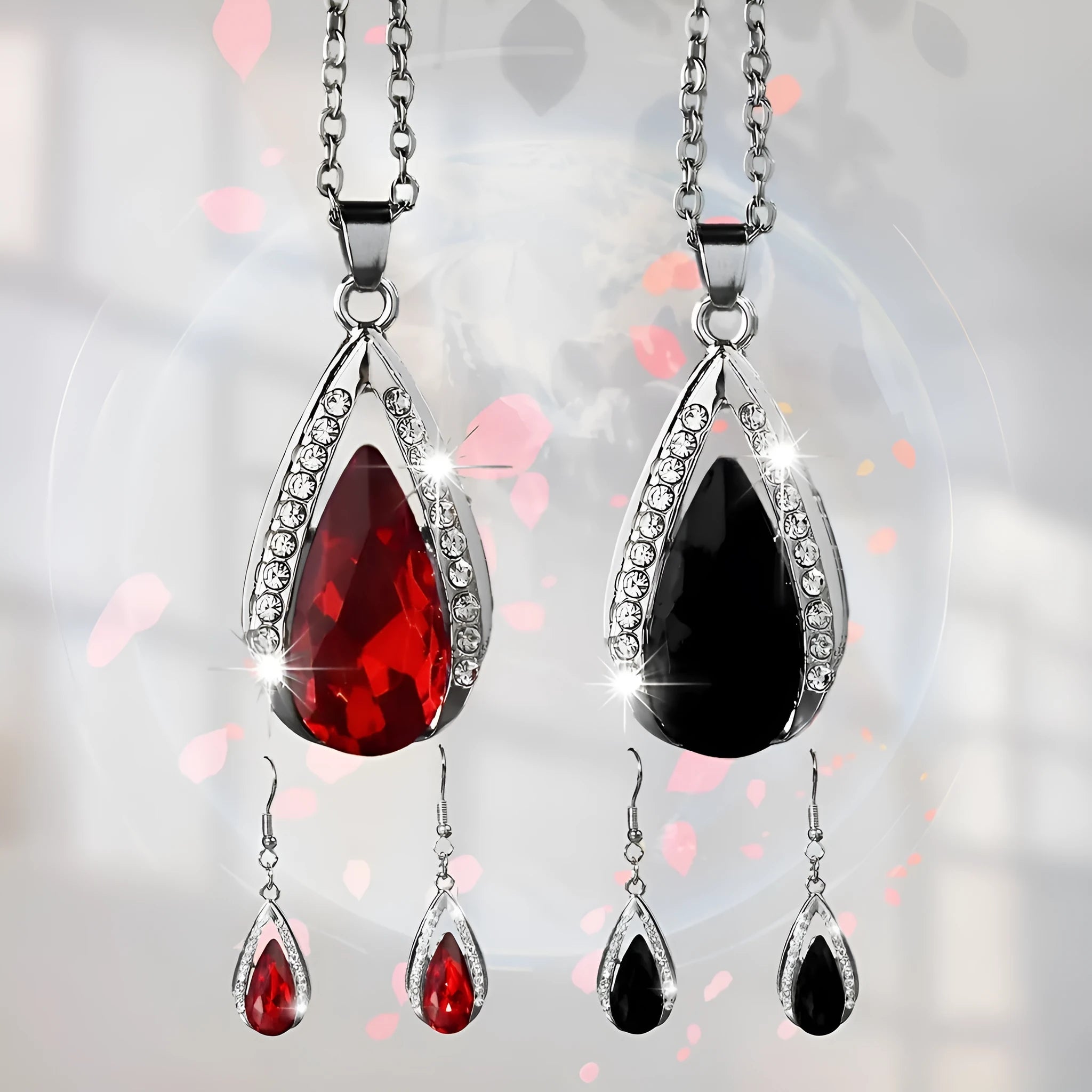 Black and red teardrop pendant alloy necklace and matching earrings set on a white background.