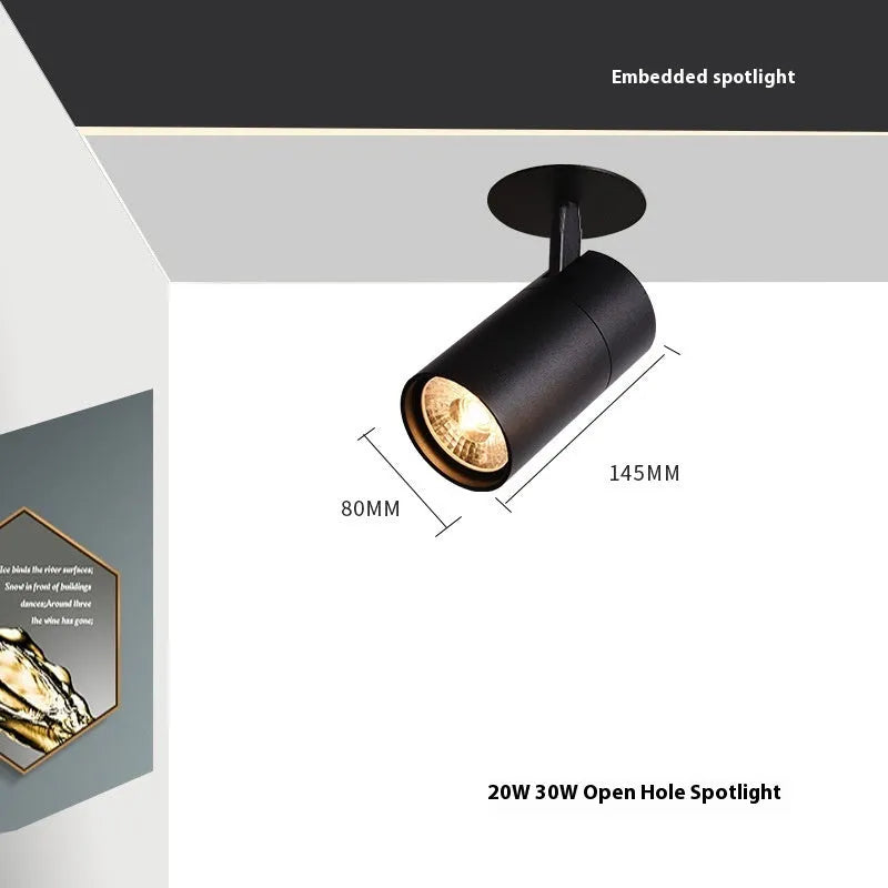 Black and white aluminium cylinder track spotlight for 55-75mm hole installation.