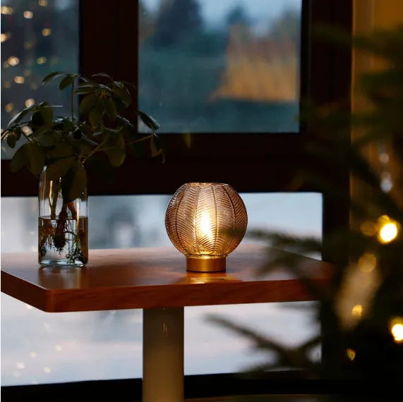 Wireless battery miniature decorative lamp with amber light in geometric stereo modern simplicity design on a tabletop
