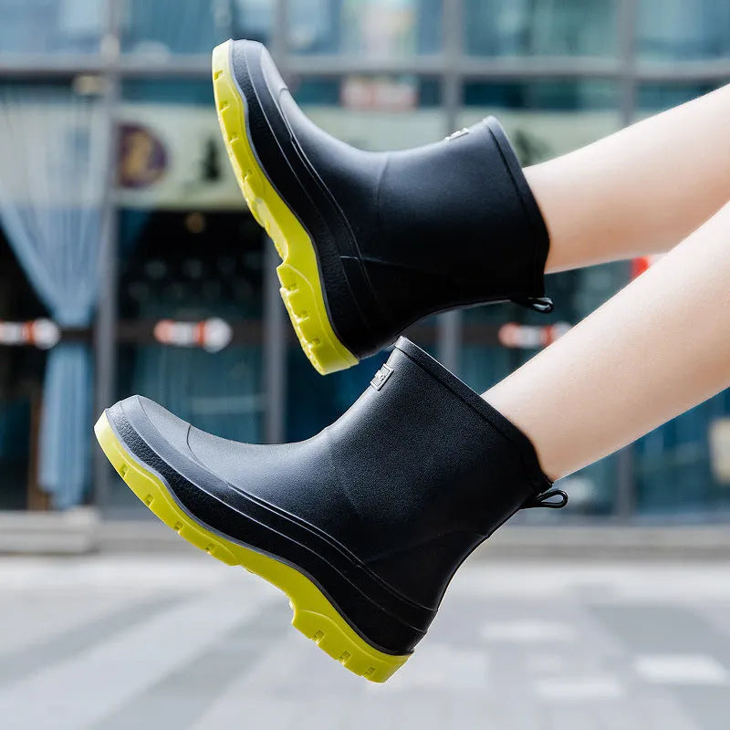 Women's short plastic waterproof rubber shoes in black, shown on a white background.