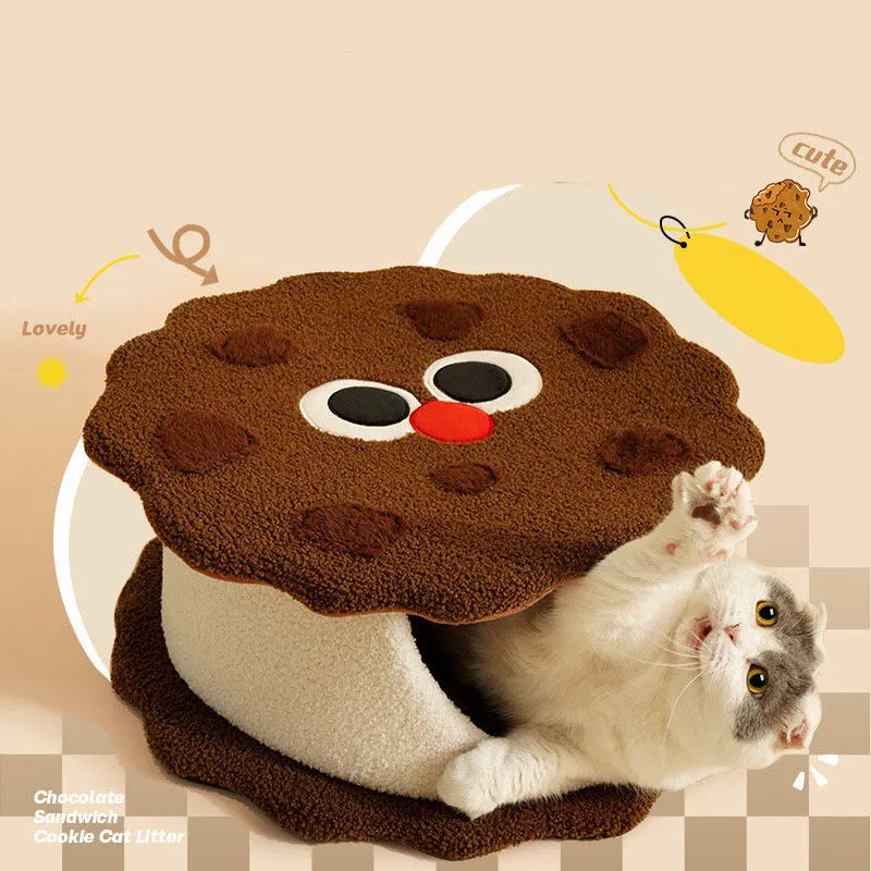 Khaki coloured enclosed cat nest shaped like a sandwich cookie for cold weather sleeping.