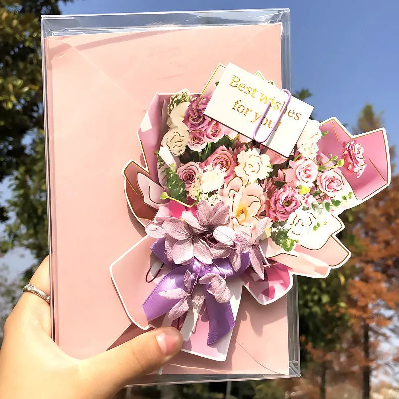 Handmade 3D butterfly-shaped greeting card with artificial flowers in a box, alongside its matching envelope.