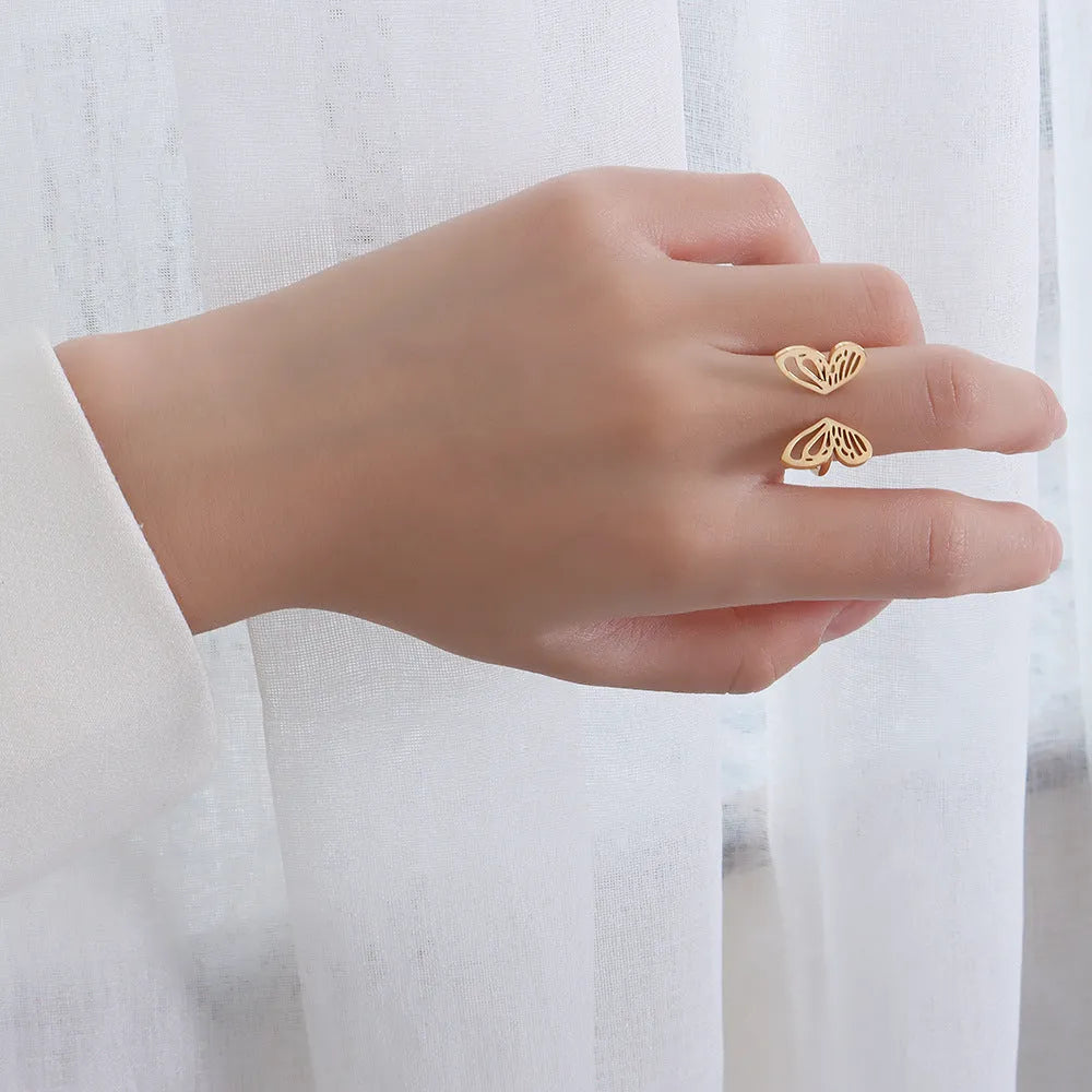 Titanium steel hollow butterfly ring with adjustable opening in gold colour