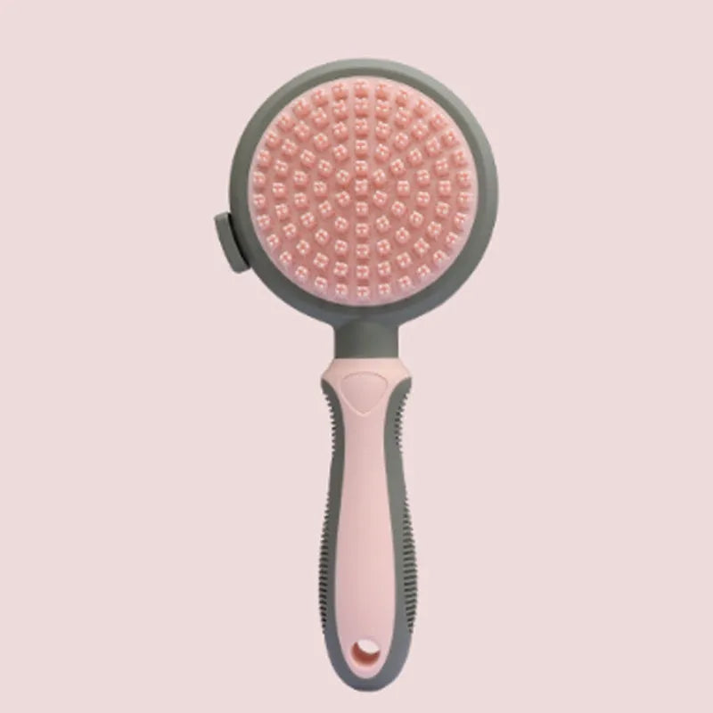 Green two-sided cat brush with retractable slicker and silicone massage pins on plastic handle