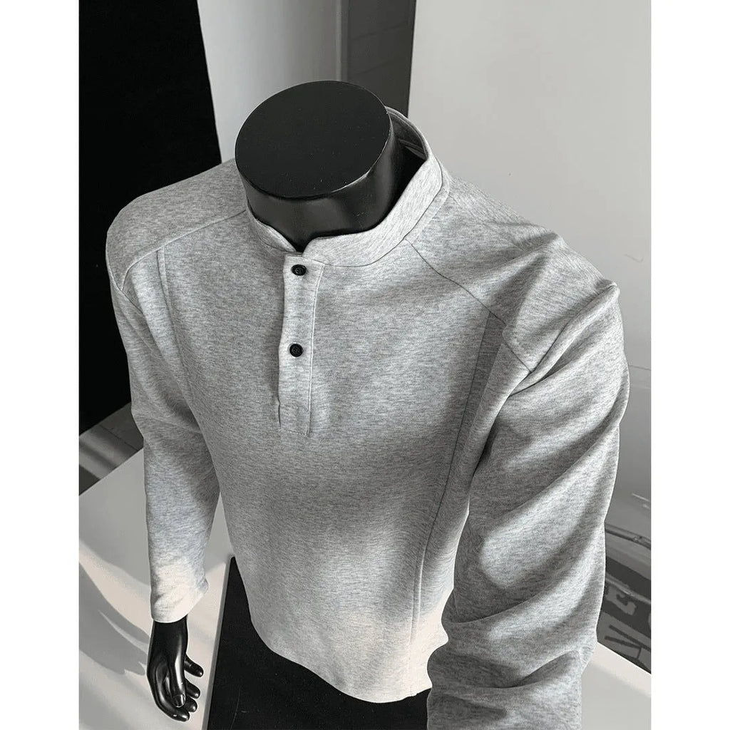 Men's patchwork stand-up collar sweater in black with asymmetric shoulder and long sleeves, loose fit