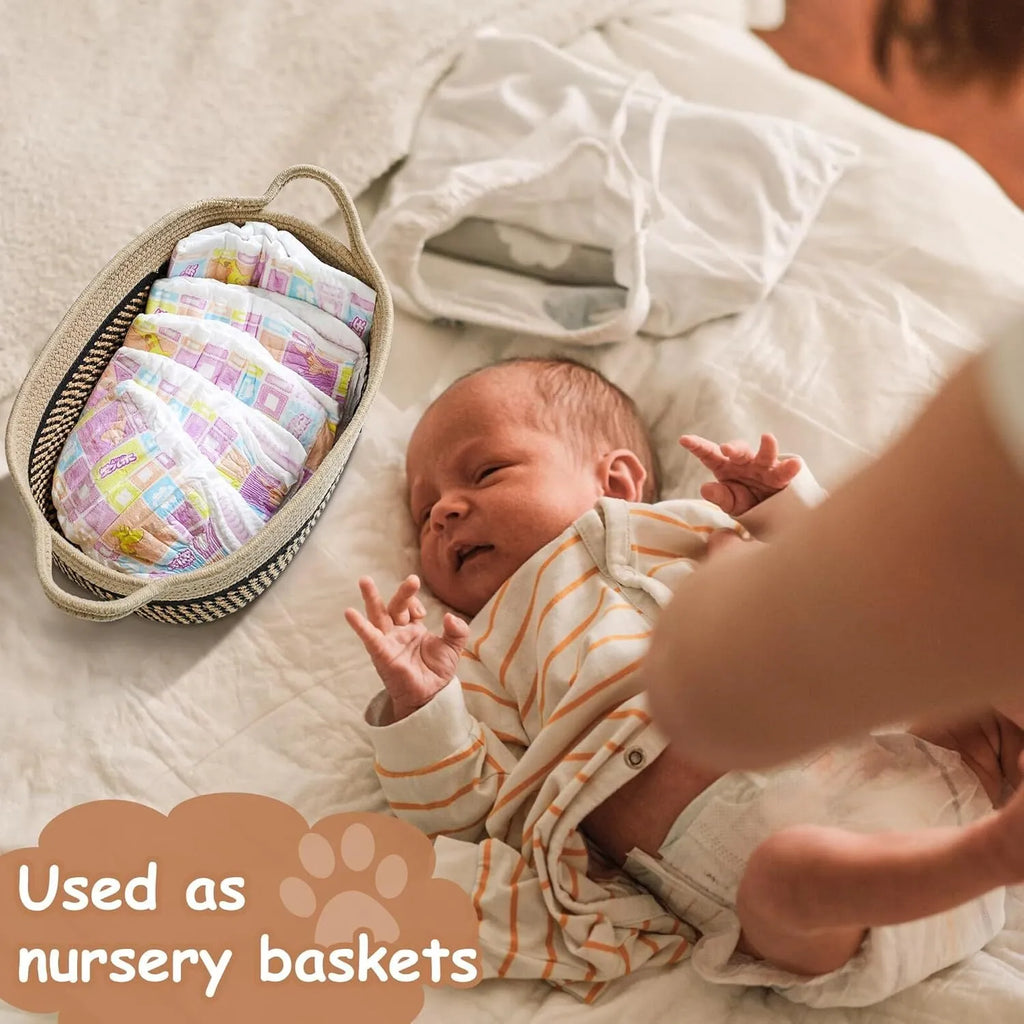 Light beige handmade woven cotton rope storage basket with wooden handle.