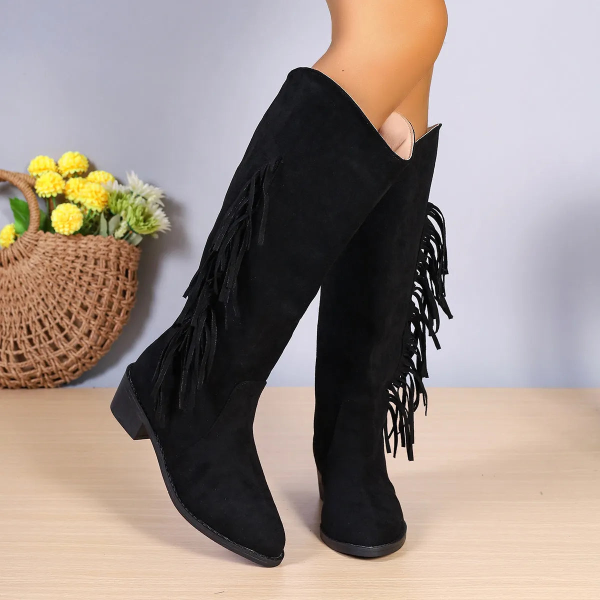 Women's winter fringe chunky heel western boots in black PU with tassel detail and pointed toe