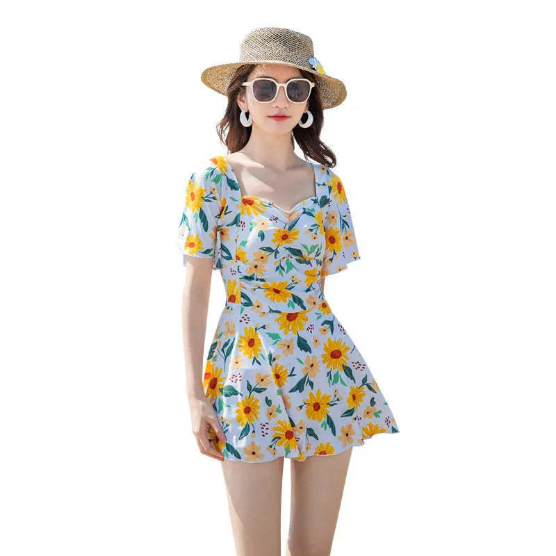 Women's slim-fit one-piece swimsuit with floral print in blue, red, or yellow pattern options.