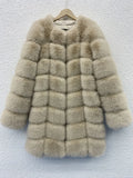 Women's long artificial fur coat in a choice of colours including apricot and black, showing regular sleeves.