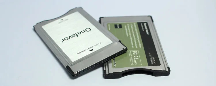 Mercedes-Benz SD to PCMCIA adapter card with stainless steel housing and inserted 32GB SDHC memory card.