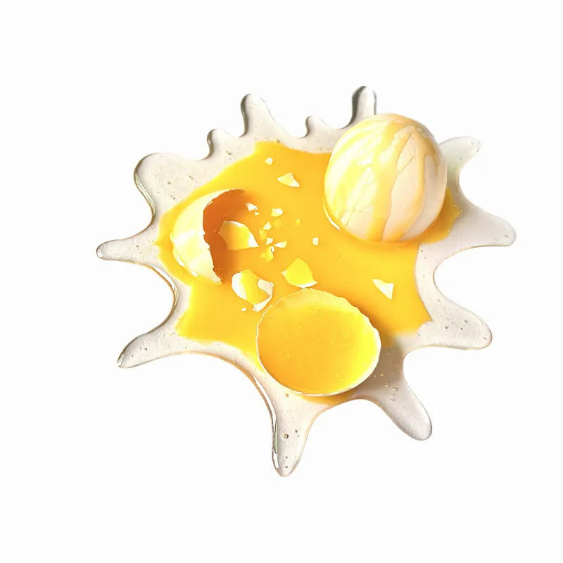 Broken egg shaped decompression toy mobile phone holder measuring 15x17cm in broken egg colour