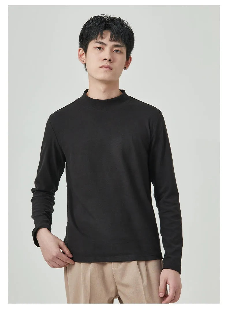 Men's brown Dralon fabric long sleeve t-shirt with a half-high collar on a hanger.