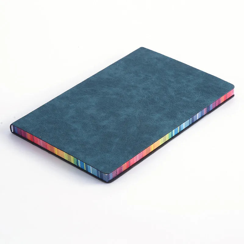 A5 rainbow side PU leather cover notebook open on a desk, showing lock line hardcover binding and 100g Daolin paper pages