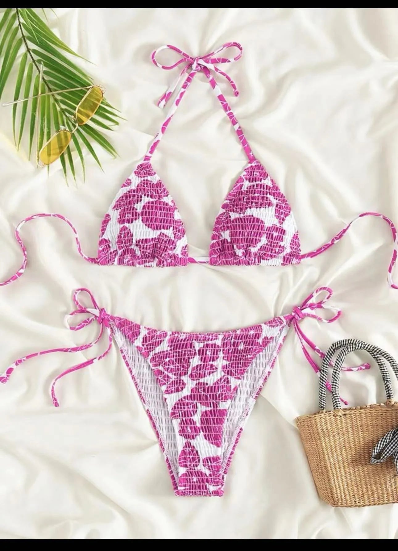 Women's floral halter swimsuit in polyester fabric showing pink colour option with brief-style bottoms