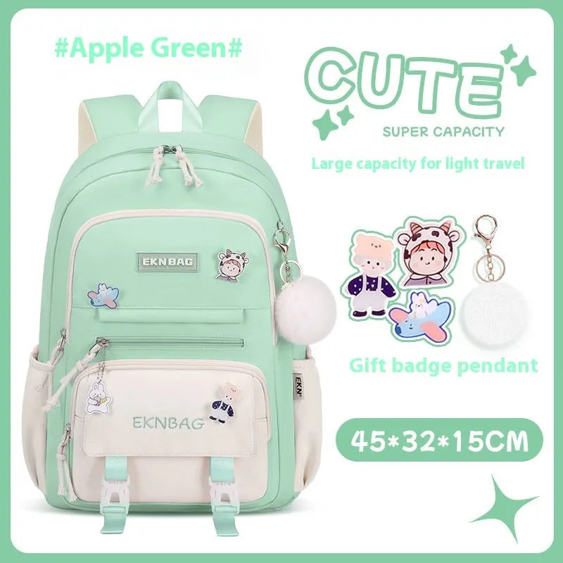 Girls' pink waterproof Oxford cloth school backpack with curved shoulder straps.