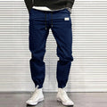 Loose fit quick-dry running trousers in polyester nylon blend, available in four colours and sizes M to XXXL