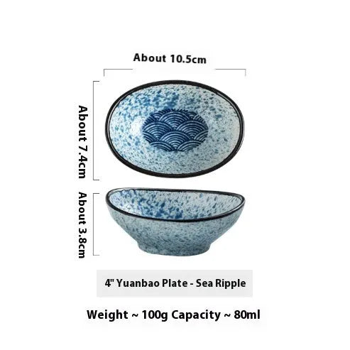 Oval-shaped Japanese ceramic sauce dipping bowl with an underglaze decorative pattern.